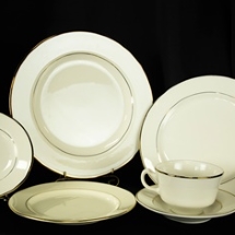 Place setting of china plates for rent.