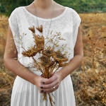 Woman holding dried flowers bouquet
